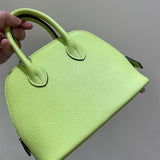 Side view of clean-lined structured handbag