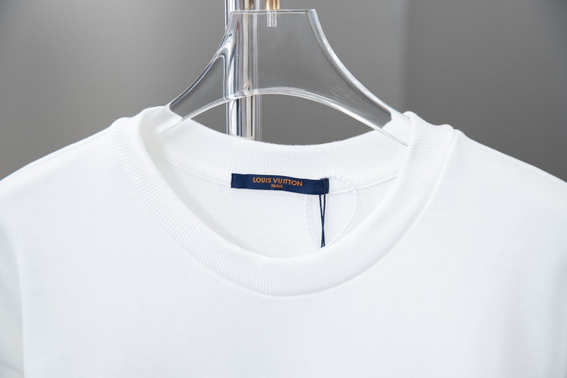 Close-up detail shot of Louis Vuitton luxury clothing with logo-detail design
