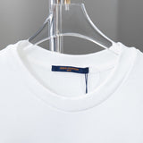 Close-up detail shot of Louis Vuitton luxury clothing with logo-detail design