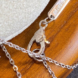 Angled view of Van Cleef & Arpels unisex jewelry piece