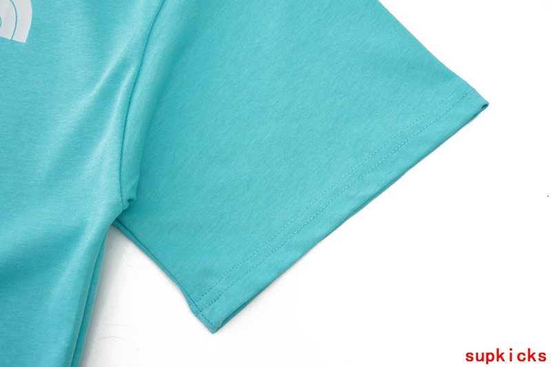 Side profile of Rhude luxury clothing with logo-detail design
