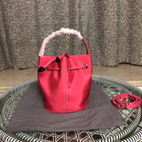 Close-up detail of sleek statement women's handbag – women's statement bag
