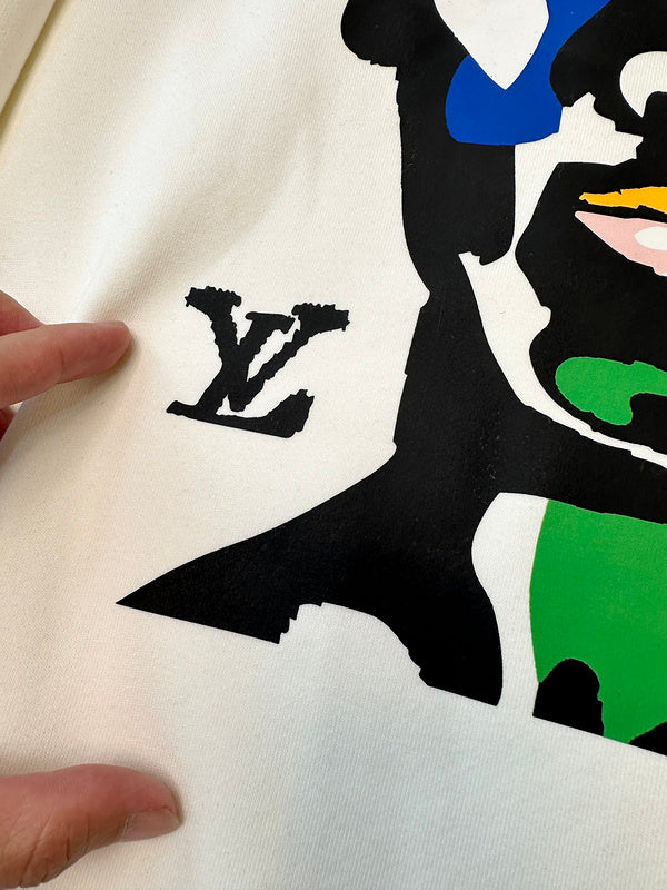 Side profile of Louis Vuitton luxury clothing with tailored silhouette
