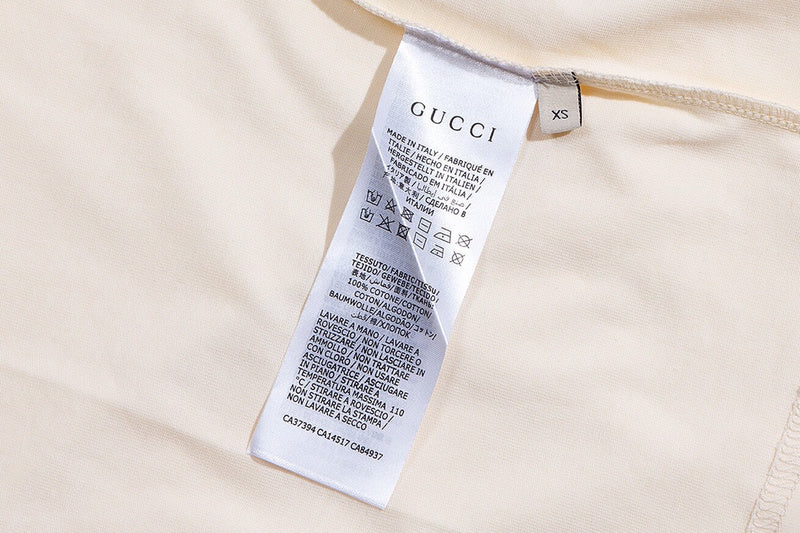 Close-up detail shot of Gucci luxury clothing with signature branding