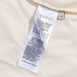Close-up detail shot of Gucci luxury clothing with signature branding