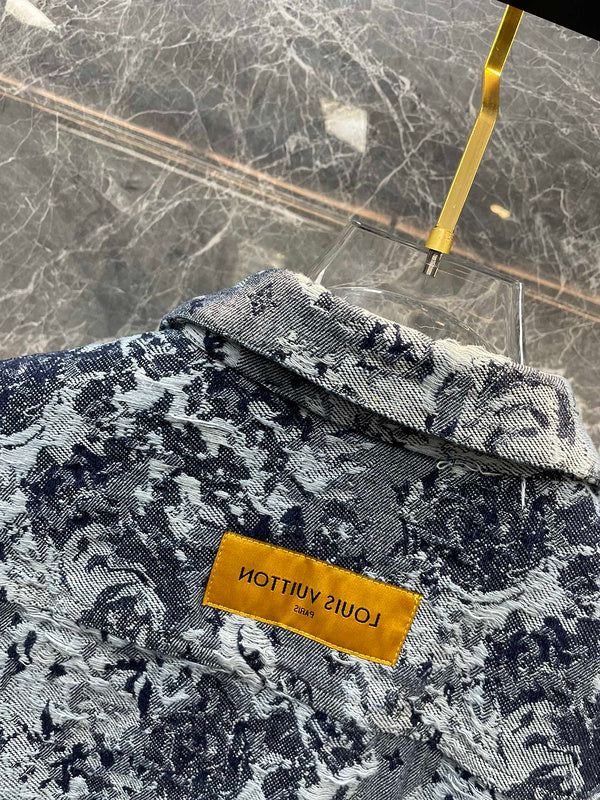 Close-up detail shot of Louis Vuitton luxury clothing with logo-detail design