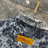 Close-up detail shot of Louis Vuitton luxury clothing with logo-detail design