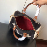 Styled lifestyle shot of signature premium women's handbag – women's statement bag