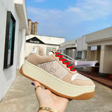 Side profile of Gucci two-tone sneakers streetwear statement look