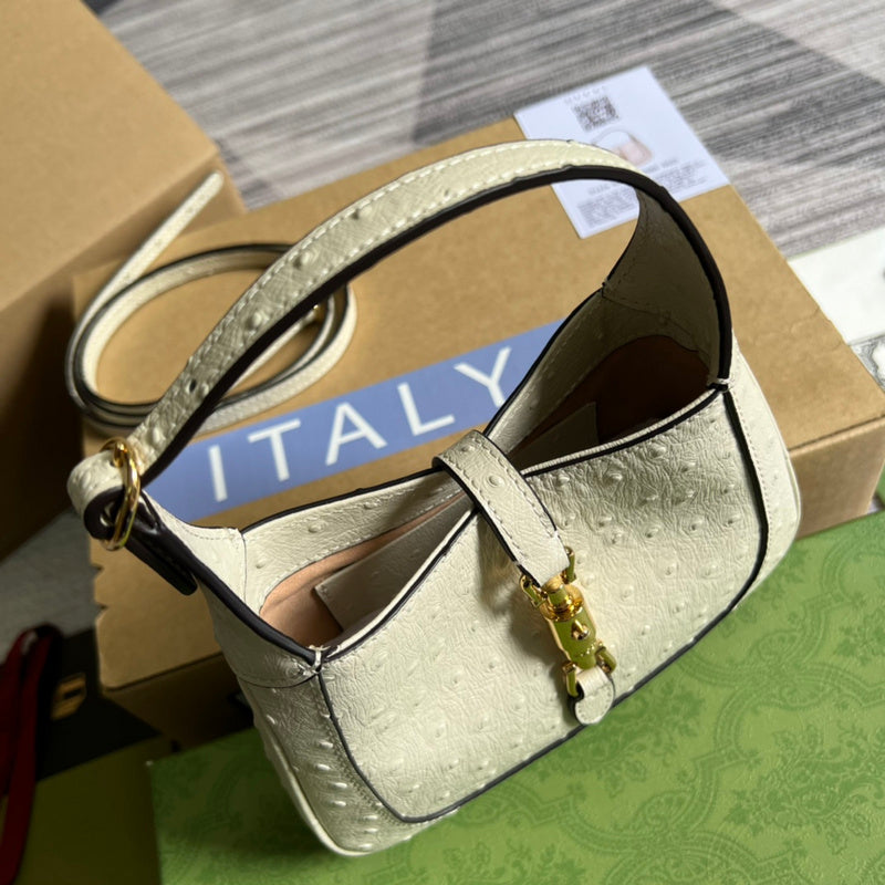 Handle and strap detail of polished statement women's handbag – women's luxury accessory