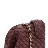 Close-up of Bottega Veneta clutches hardware and fine stitching