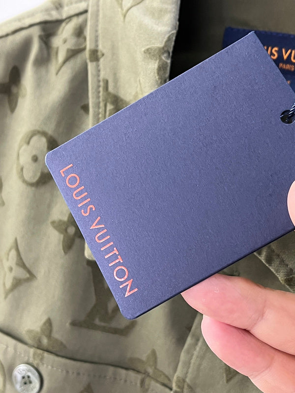 Flat lay presentation of Louis Vuitton luxury clothing with runway-inspired design
