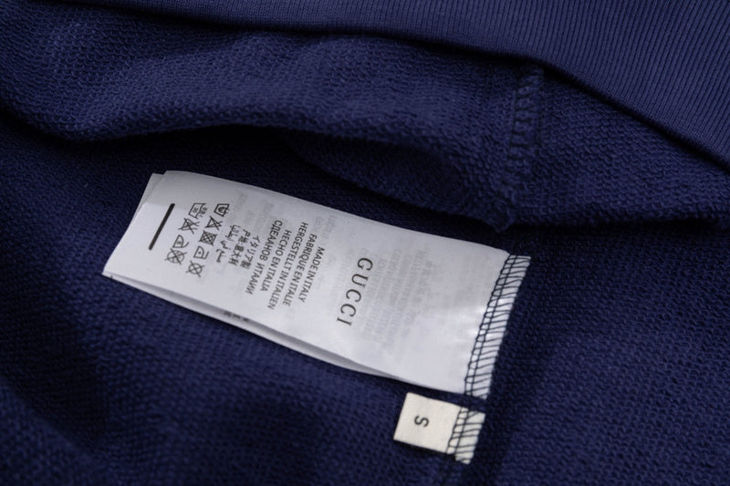 Close-up detail shot of Gucci luxury clothing with tailored silhouette