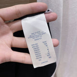 Close-up detail shot of Louis Vuitton luxury clothing with streetwear-inspired cut