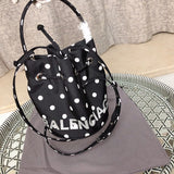 Back view of polished elevated women's handbag – women's luxury accessory