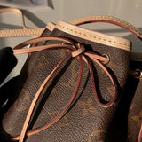 Back view of statement polished women's handbag – women's statement bag