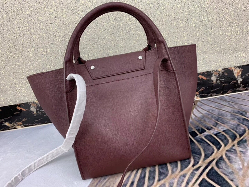 Styled lifestyle shot of signature statement women's handbag – women's premium purse
