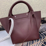 Styled lifestyle shot of signature statement women's handbag – women's premium purse