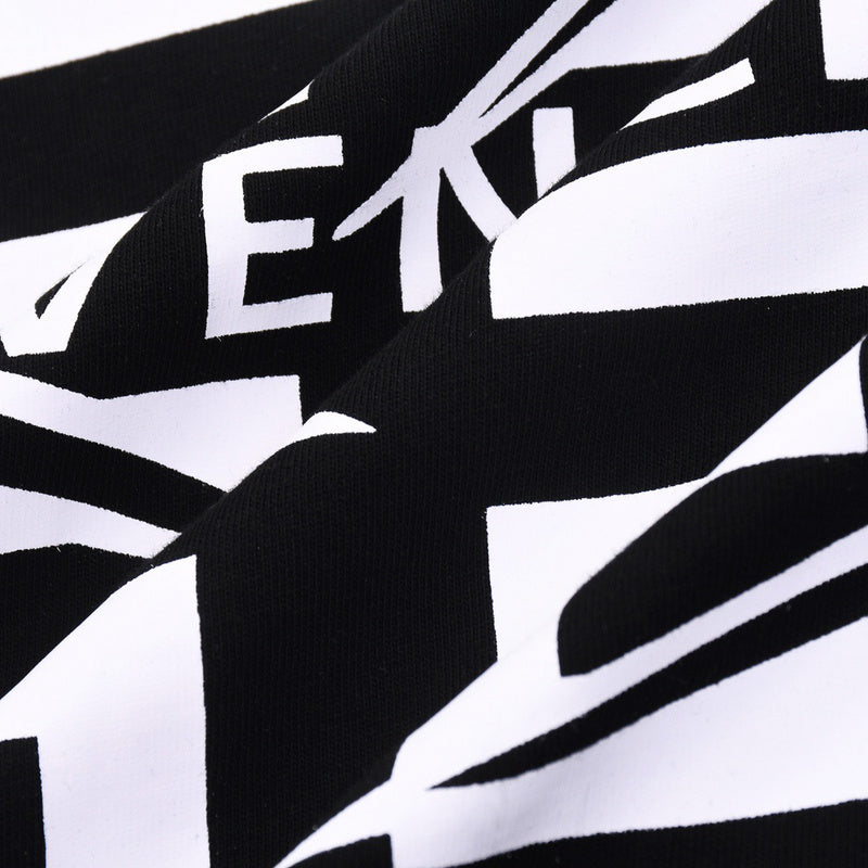 Close-up detail shot of Givenchy luxury clothing with monogram-inspired silhouette