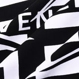 Close-up detail shot of Givenchy luxury clothing with monogram-inspired silhouette