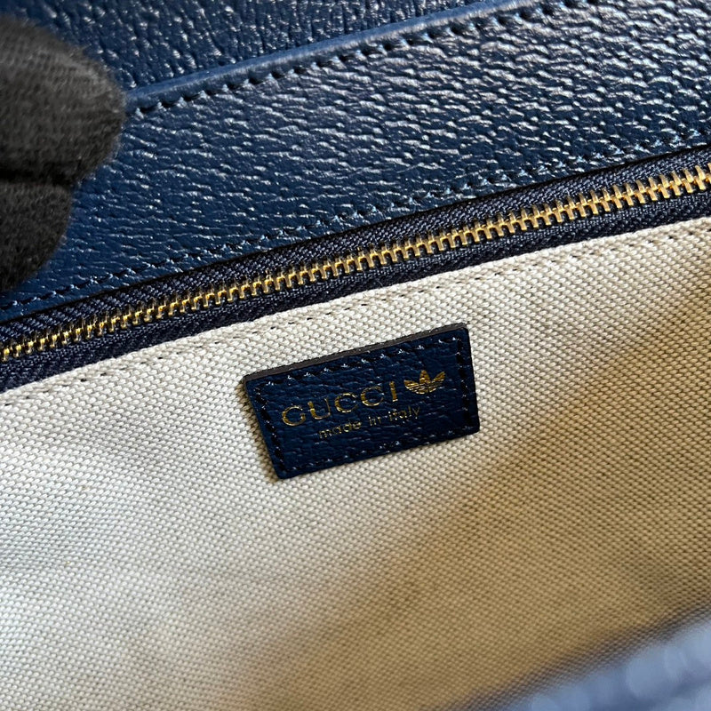 Side profile of elevated classic women's handbag – women's luxury accessory