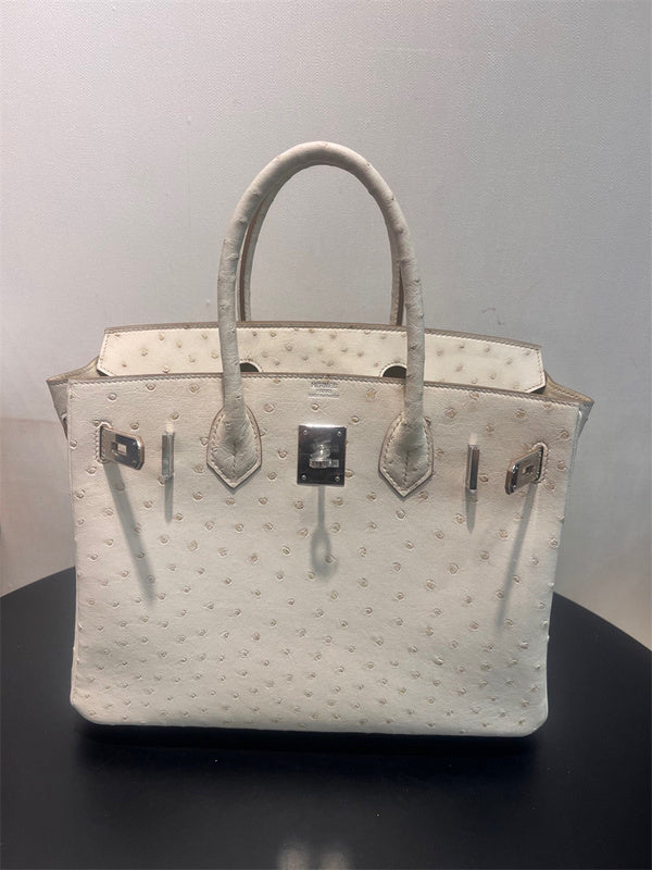 Side view of structured structured handbag