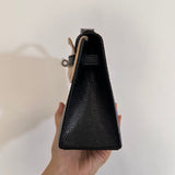  clean-lined crossbody bag styled with outfit