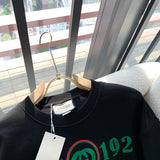 Front view of Gucci luxury clothing with monogram-inspired silhouette