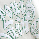 Side profile of Louis Vuitton luxury clothing with logo-detail design