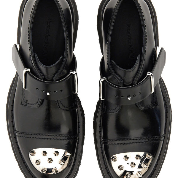 Close-up of Alexander McQueen athletic hardware and fine stitching