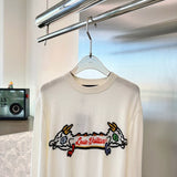 Close-up detail shot of Louis Vuitton luxury clothing with monogram-inspired silhouette