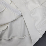 Front view of Gucci luxury clothing with label-forward styling
