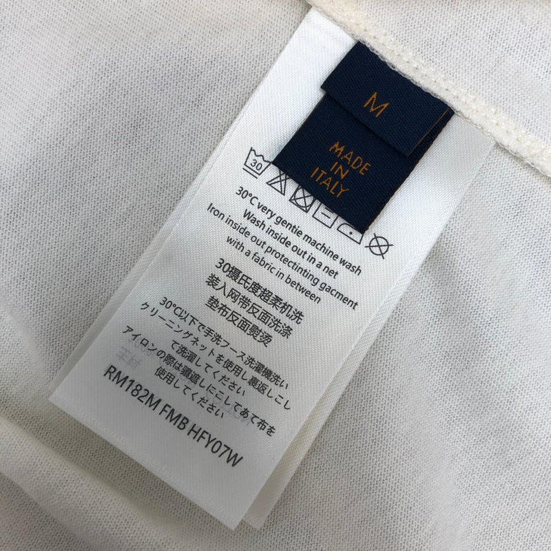 Flat lay presentation of Louis Vuitton cotton t-shirt with label-forward styling