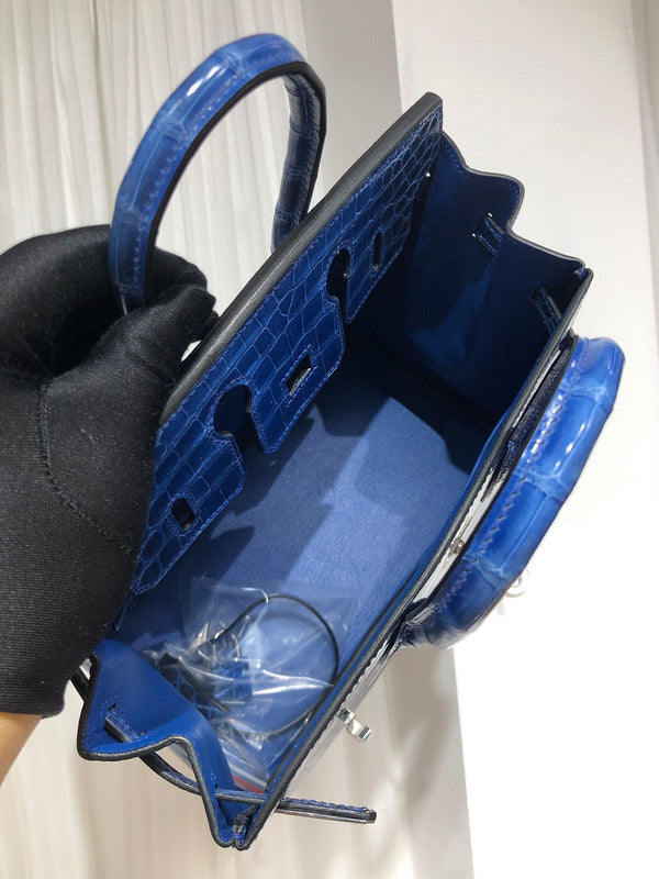 Side view of sculpted structured handbag