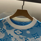Flat lay presentation of Louis Vuitton luxury clothing with contemporary cut