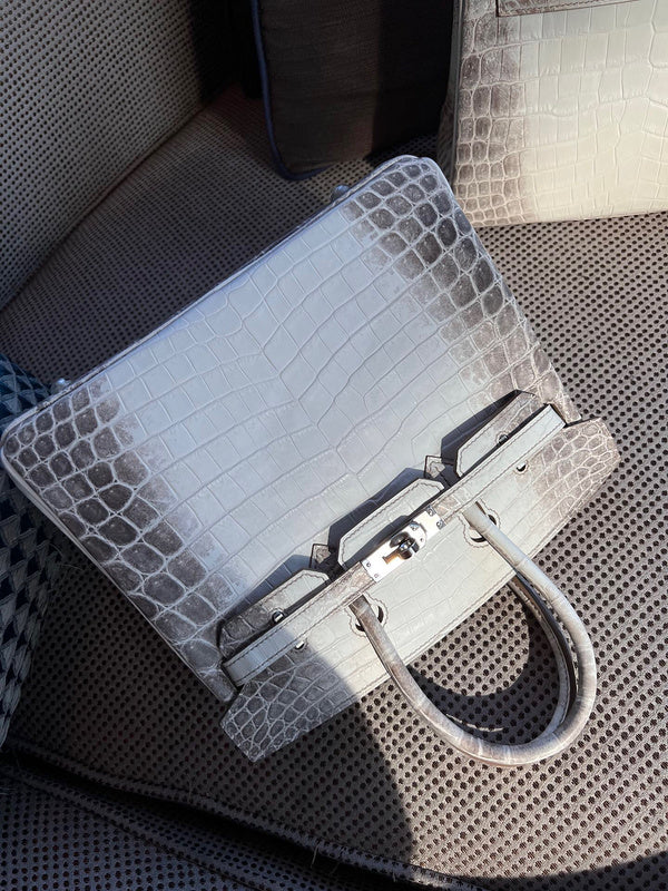 Side view of modern structured handbag