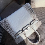 Side view of modern structured handbag