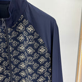 Full styled look of Louis Vuitton luxury clothing with label-forward styling