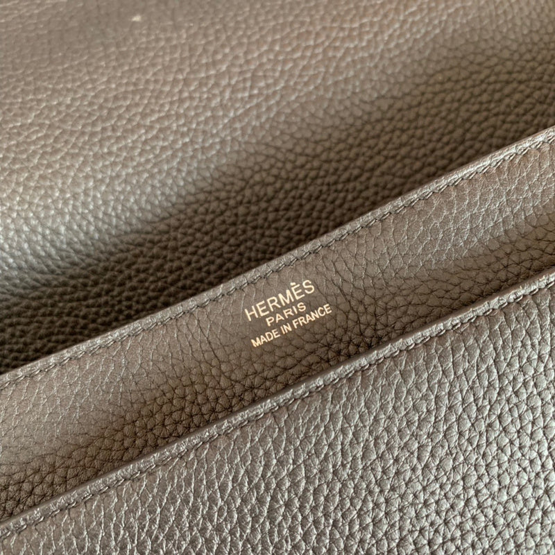 Side view of sleek structured handbag