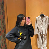 Back view of Louis Vuitton luxury clothing with streetwear-inspired cut