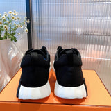 Hermès White High-Top Sneakers - Angled View