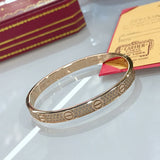 Side view of Cartier unisex jewelry piece