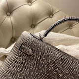  streamlined top-handle bag styled with outfit