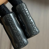 Back view of Louis Vuitton luxury clothing with signature branding