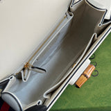 Side profile of chic signature women's handbag – women's statement bag