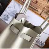 Side view of sculpted structured handbag