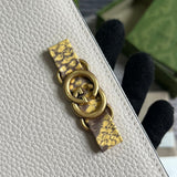 Handle and strap detail of modern structured women's handbag – women's designer-style accessory