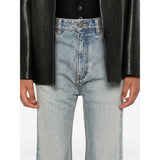 Close-up of Balenciaga pants hardware and fine stitching