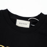 Close-up detail shot of Gucci luxury clothing with relaxed-fit cut