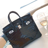 Side view of understated structured handbag